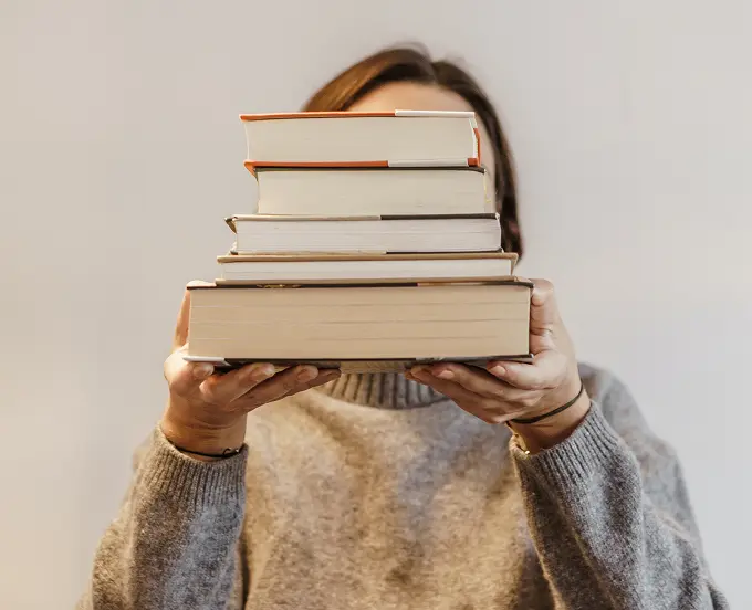 Woman holding books